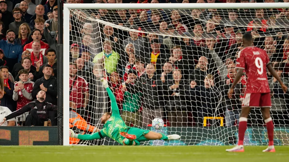 Atletico Madrid's goalkeeper Jan Oblak receives the second goal by Liverpool's Alexis Mac Allister during the Champions League opening phase soccer match between Liverpool and Atletico Madrid in Liverpool, England, Wednesday, Sept. 9, 2026. (AP Photo/Dave Thompson)