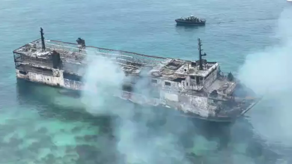 In this image taken from video provided by the Philippine Coast Guard, remains of ferry MV June Aster that caught fire off Palawan province, western Philippines on Thursday Sept. 10, 2026. (Philippine Coast Guard via AP)