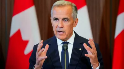 FILE PHOTO: Canada's Prime Minister Mark Carney speaks with the news media after he suspended trade negotiations with the United States, in Ottawa, Ontario, Canada August 22, 2026. REUTERS/Chris Tanouye/File Photo