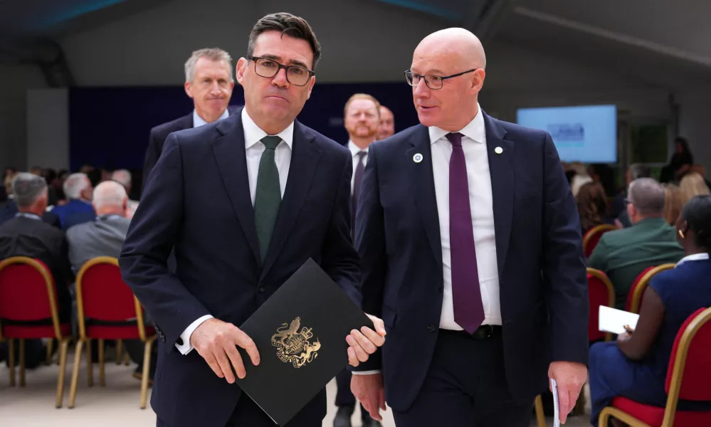 LONDON, ENGLAND - AUGUST 21: Prime Minister Andy Burnham and Scottish First Minister John Swinney leave after the first National Day for Victims and Survivors of Terrorism memorial event at Lancaster House on August 21, 2026 in London, England.  Carl Court/Pool via REUTERS