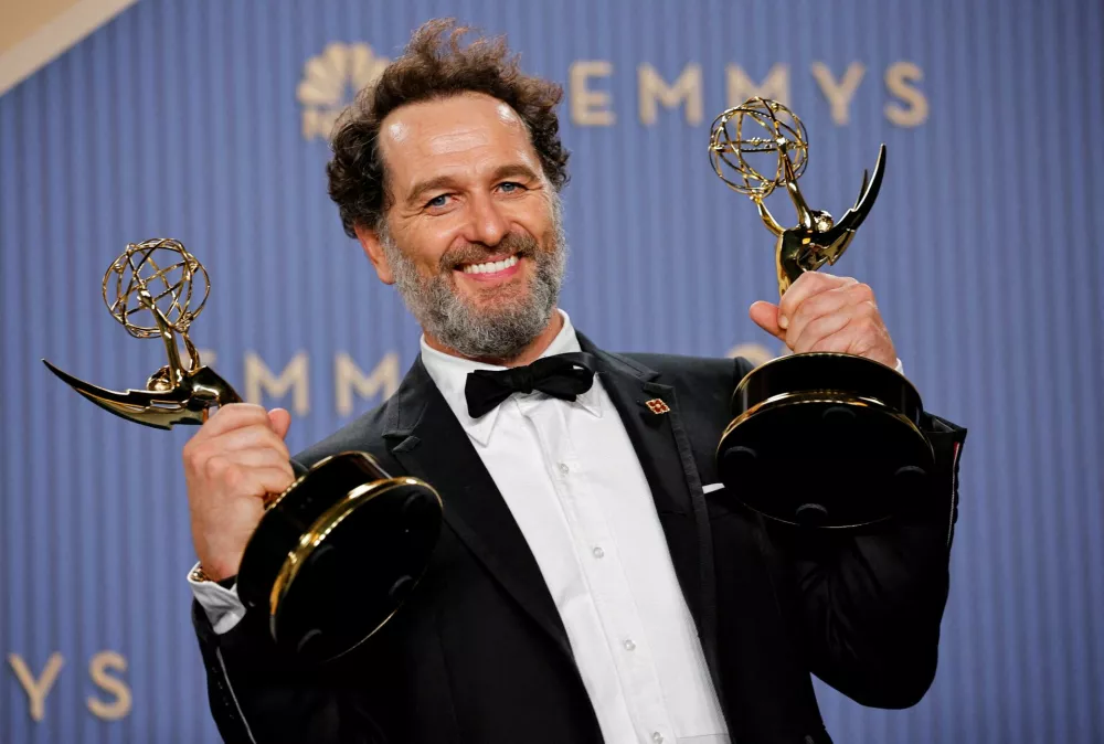 Matthew Rhys poses with the Outstanding Lead Actor in a Comedy Series Award for "Widow's Bay" and the Outstanding Lead Actor in a Limited or Anthology Series or Movie Award for "The Beast in Me", during the 78th Primetime Emmy Awards in Los Angeles, California, U.S., September 14, 2026. REUTERS/Mike Blake REFILE - REPEATING WITH FULL CAPTIONS