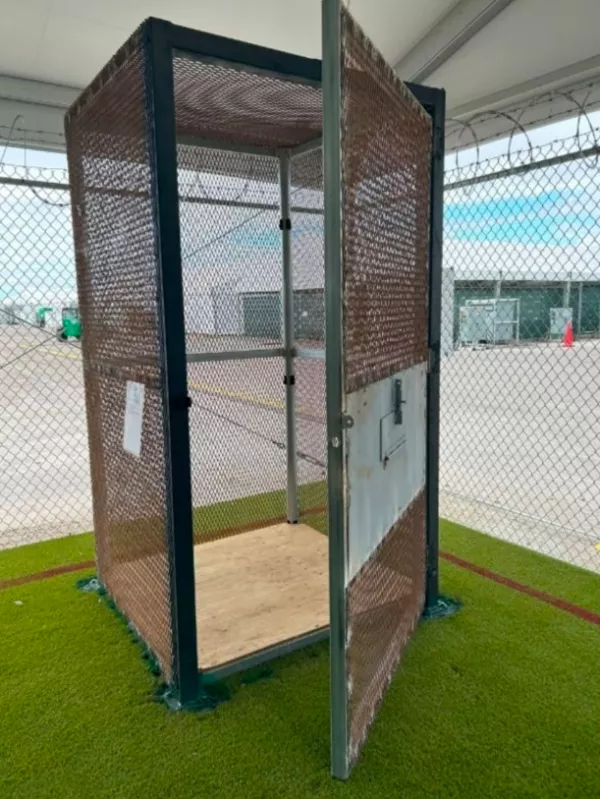 This image released by the Department of Homeland Security Office of Inspector General shows a small metal enclosure used to to house detainees at the "Alligator Alcatraz" immigration detention center in the Florida Everglades in Collier County, Fla., Jan. 21, 2026. (DHS OIG via AP)