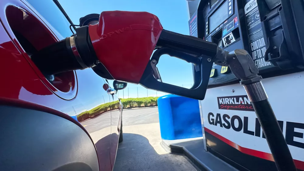 FILE - A motorist fills up the tank of a vehicle at a Costco gasoline station Wednesday, April 15, 2026, in Sheridan, Colo. (AP Photo/David Zalubowski, file)