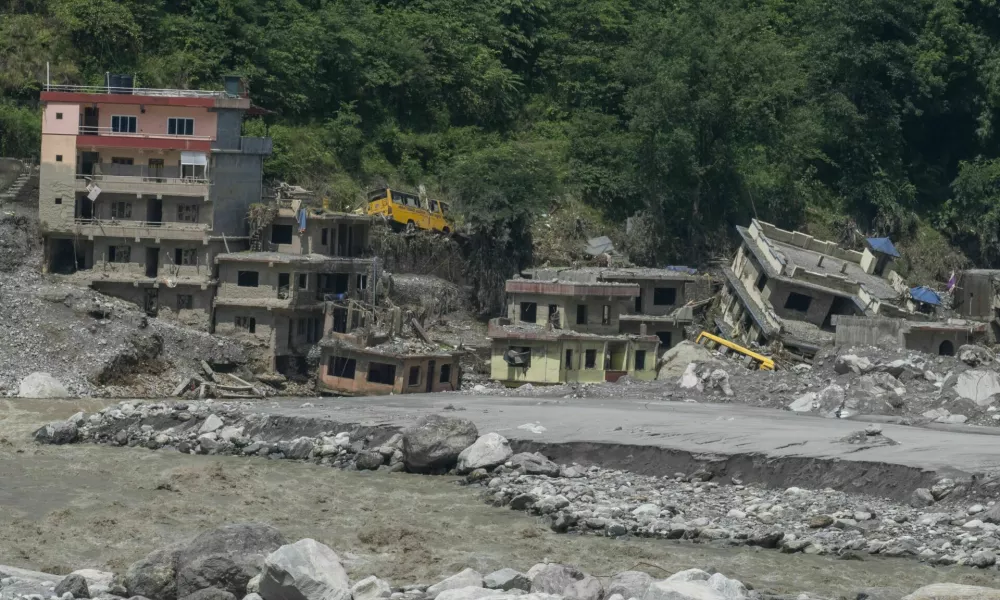 NUWAKOT, NEPAL - SEPTEMBER 14: Aftermath of devastating flash floods that struck Nepal on August 26 is seen in Nuwakot, where people in the affected areas continue to return to the ruins of their homes, searching for belongings and the last remnants of lives that were swept away, in Bagmati province, central Nepal, on September 14, 2026. Some survivors salvage whatever they can from the debris, while others stand silently at the places where their homes once stood. Religious figures visit the affected areas to hold prayers for those who died in the disaster, with some prayers continuing for a day or two, while bereaved families gather to remember their loved ones and pray for the peace of their souls. Meanwhile, families searching for missing relatives continue to visit hospitals in Kathmandu, where they look through photographs and lists of missing people displayed on hospital walls. Some use mobile phone video calls to show the photographs to family members and seek help identifying their missing loved ones, in Nuwakot, northwest of Kathmandu. Abdul Goni / AnadoluNo Use USA No use UK No use Canada No use France No use Japan No use Italy No use Australia No use Spain No use Belgium No use Korea No use South Africa No use Hong Kong No use New Zealand No use Turkey
