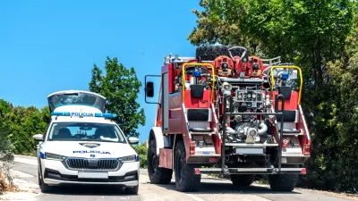 Labin,Croatia, 2023: Police car (Policija) and fire truck (vatrogasci) on a country road near Labin