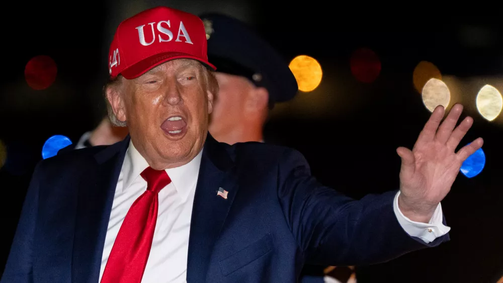 President Donald Trump waves as he arrives on Air Force One, Wednesday, Sept. 16, 2026, at Joint Base Andrews, Md. (AP Photo/Alex Brandon)