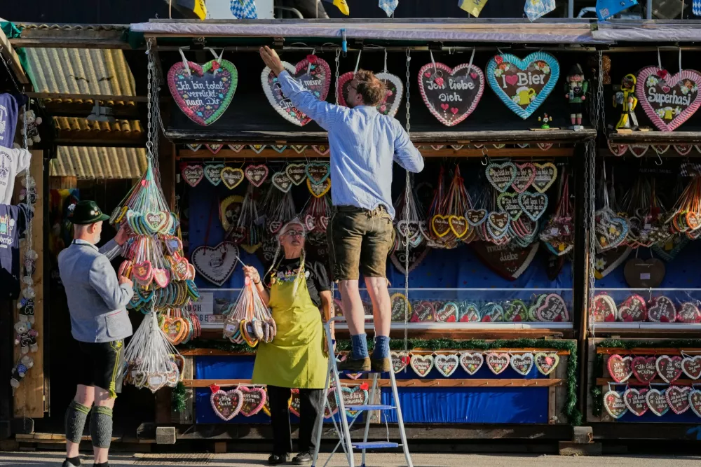 A vendor prepares for the 191st Oktoberfest beer festival in Munich, Germany, Saturday, Sept.19, 2026. (AP Photo/Matthias Schrader)