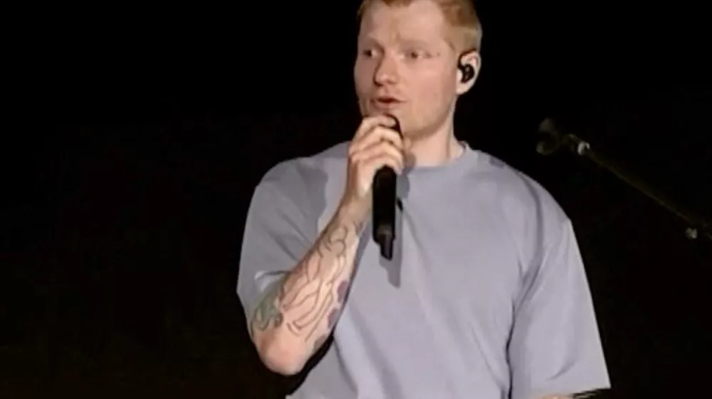 Singer Ed Sheeran speaks on stage as he addresses a controversy over Macklemore being pulled from the tour after saying "Free Palestine" at a show early this month, in Philadelphia, Pennsylvania, US September 19, 2026, in this screen grab obtained from a video. Ed Sheeran via Instagram/Handout via REUTERS THIS IMAGE HAS BEEN SUPPLIED BY A THIRD PARTY. NO RESALES. NO ARCHIVES. MANDATORY CREDIT.   TPX IMAGES OF THE DAY