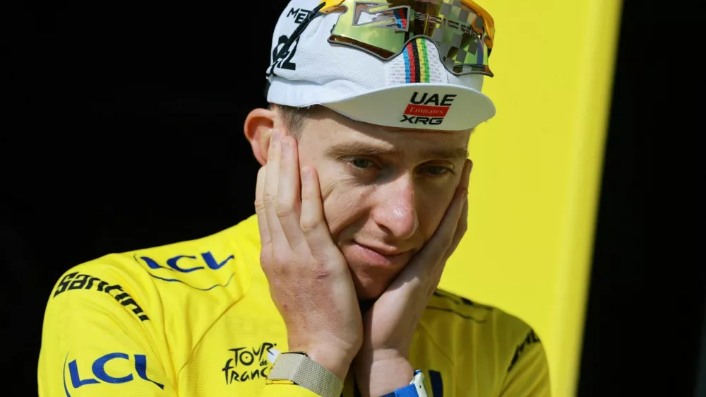Cycling - Tour de France - Stage 15 - Champagnole to Plateau de Solaison - Plateau de Solaison, France - July 19, 2026 UAE Team Emirates XRG's Tadej Pogacar reacts on the podium wearing the yellow jersey after stage 15 REUTERS/Stephanie Lecocq