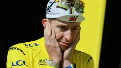 Cycling - Tour de France - Stage 15 - Champagnole to Plateau de Solaison - Plateau de Solaison, France - July 19, 2026 UAE Team Emirates XRG's Tadej Pogacar reacts on the podium wearing the yellow jersey after stage 15 REUTERS/Stephanie Lecocq
