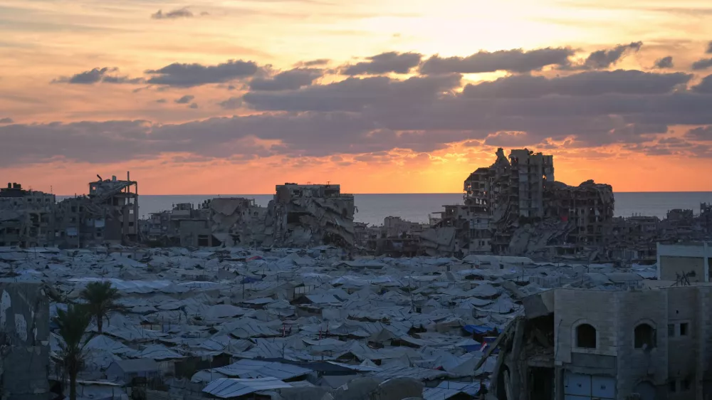 Tents sheltering displaced Palestinians are seen amid war-damaged buildings in Gaza City, Wednesday, Sept. 23, 2026. (AP Photo/Jehad Alshrafi)