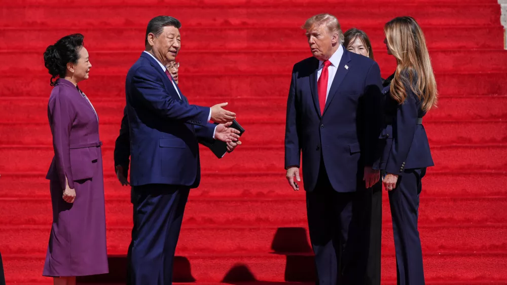 President Donald Trump, center right, and first lady Melania Trump, right, speak with China's President Xi Jinping, center left, and his wife Peng Liyuan&nbsp;on the steps of the National Archives Museum, Friday, Sept. 25, 2026, in Washington. (AP Photo/Julia Demaree Nikhinson)