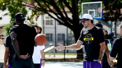 Basketball - NBA - Los Angeles Lakers visit to Ljubljana - Ljubljana, Slovenia - August 23, 2026 Los Angeles Lakers' Luka Doncic on the court where he played growing up in Ljubljana REUTERS/Borut Zivulovic