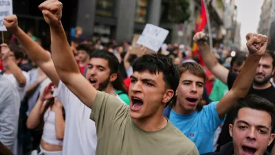 Activists protest near the Spanish Parliament following the eviction of 87-year-old Maria del Carmen Abascal to demand stronger laws to protect renters in Madrid, Spain, Friday, Oct. 2, 2026. (AP Photo/Manu Fernandez)