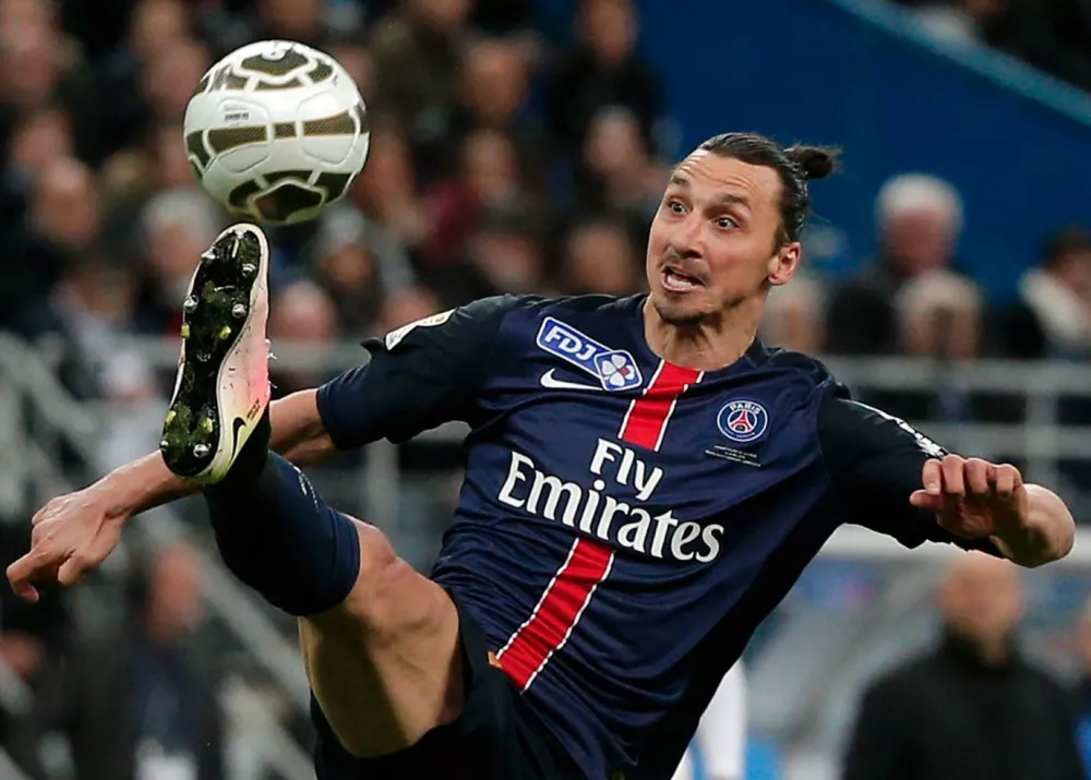 FILE - In this Saturday, April 23, 2016 file photo, PSG's Zlatan Ibrahimovic controls the ball during the League Cup final soccer match between Paris Saint Germain and Lille, at the Stade de France stadium, in Saint Denis, north of Paris. The 34-year-old Sweden forward, Ibrahimovic has signed for English club Manchester United, it is announced Friday July 1, 2016, handing one of soccer&acirc;&euro;&trade;s most enigmatic players a late career move to the world&acirc;&euro;&trade;s richest league. (AP Photo/Thibault Camus, file)