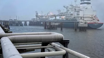 FILE PHOTO: The 'Hoegh Esperanza' Floating Storage and Regasification Unit (FSRU) is anchored during the opening of the LNG (Liquefied Natural Gas) terminal in Wilhelmshaven, Germany, December 17, 2022. Michael Sohn/Pool via REUTERS/File Photo