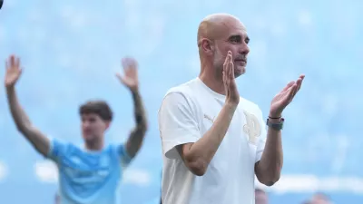 FILE - Manchester City's head coach Pep Guardiola applauds the fans after his last game with the club after a Premier League soccer match between Manchester City and Aston Villa in Manchester, England, May 24, 2026. (AP Photo/Alastair Grant, File)