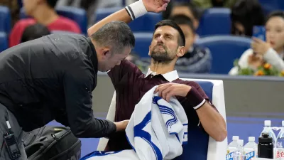 Novak Djokovic of Serbia receives a medical timeout during the first round of the men's singles match against Nuno Borges of Portugal in the China Open tennis tournament in Beijing, Wednesday, Sept. 30, 2026. (AP Photo/Andy Wong)