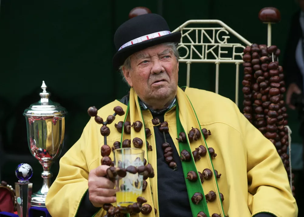 David Jakins, known as 'King Conker' sits during the annual World Conker Championships in Southwick, Britain, October 12, 2025. REUTERS/Temilade Adelaja
