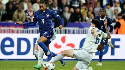 Soccer Football - Nations League - Group A1 - France v Italy - Stade de France, Saint Denis, France - October 2, 2026 France's Michael Olise in action with Italy's Alessandro Bastoni REUTERS/Catherine Steenkeste