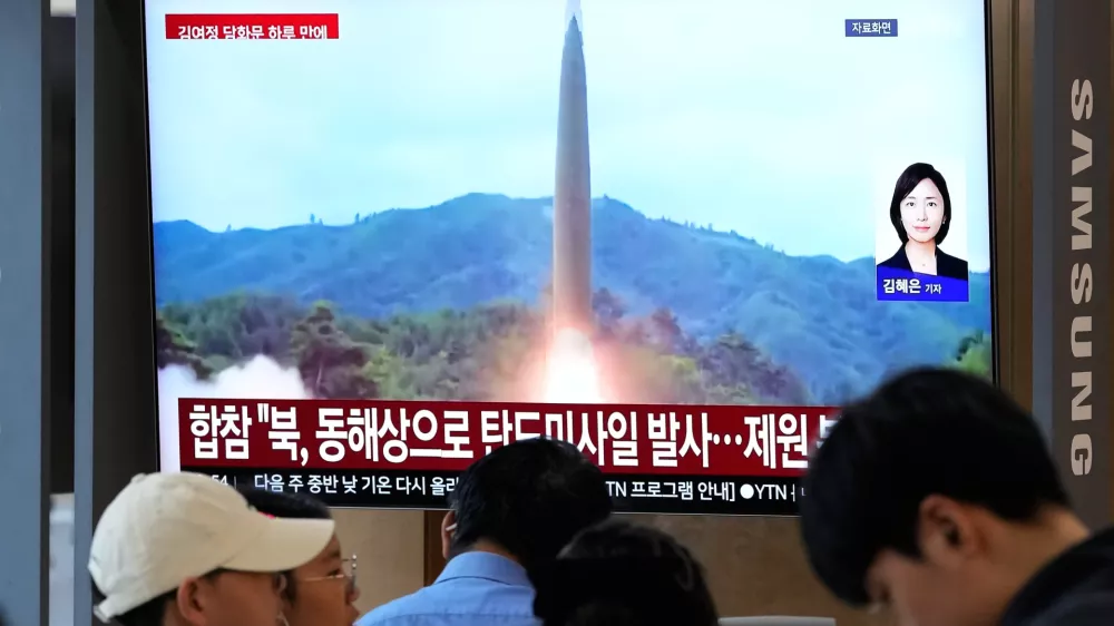 A TV screen shows a file image of a North Korean missile launch during a news program at Seoul Railway Station in Seoul, South Korea, Saturday, Oct. 3, 2026. (AP Photo/Ahn Young-joon)