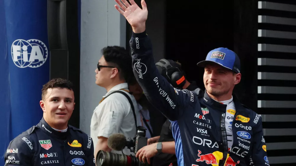 Formula One F1 - Bahrain Grand Prix - Sepang International Circuit, Sepang, Malaysia - October 3, 2026 Red Bull's Max Verstappen celebrates after qualifying in pole position with third placed Red Bull's Isack Hadjar REUTERS/Annice Lyn/Pool   TPX IMAGES OF THE DAY