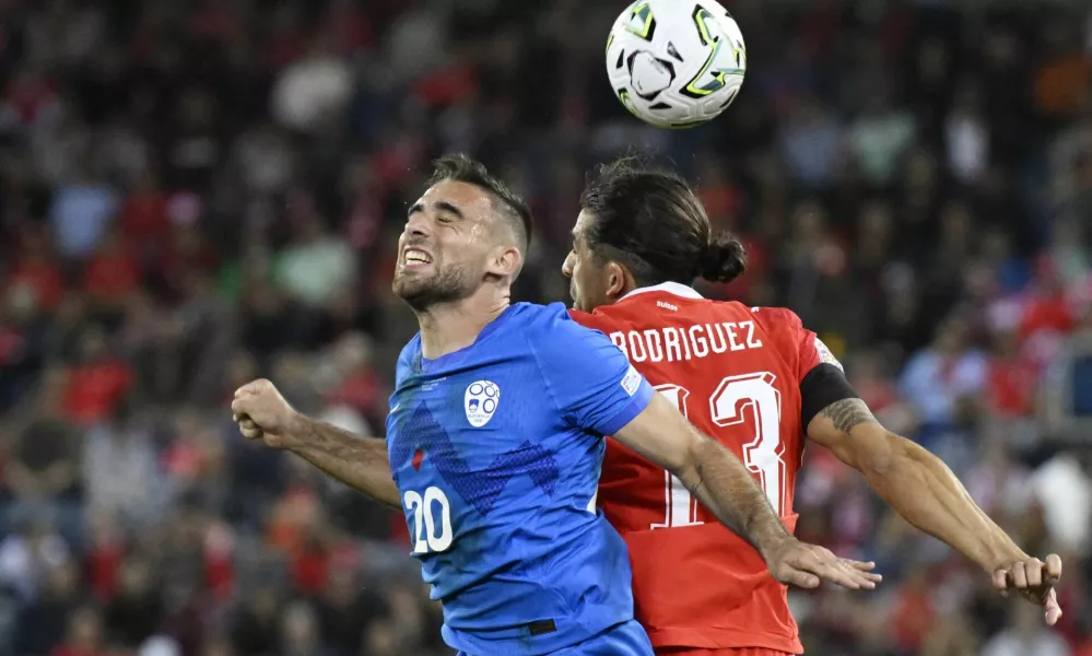 Soccer Football - Nations League - Group B1 - Switzerland v Slovenia - Thermoplan Arena, Lucerne, Switzerland - October 3, 2026 Slovenia's Aljosa Matko in action with Switzerland's Ricardo Rodriguez REUTERS/Romina Amato