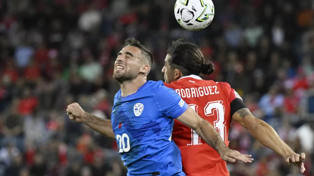 Soccer Football - Nations League - Group B1 - Switzerland v Slovenia - Thermoplan Arena, Lucerne, Switzerland - October 3, 2026 Slovenia's Aljosa Matko in action with Switzerland's Ricardo Rodriguez REUTERS/Romina Amato