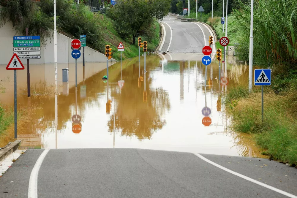 A flooded section of a road, as Spain's meteorological agency AEMET issues a red alert for Catalonia, near Barcelona, Spain, October 4, 2026. REUTERS/Albert Gea