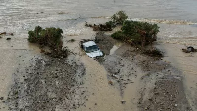 A drone view of a car and trees washed into the sea, after heavy rain continues to affect parts of Crete, prompting authorities to maintain severe weather warnings, in Therma near Ierapetra, Crete island, Greece, October 3, 2026. REUTERS/Stefanos Rapanis   TPX IMAGES OF THE DAY