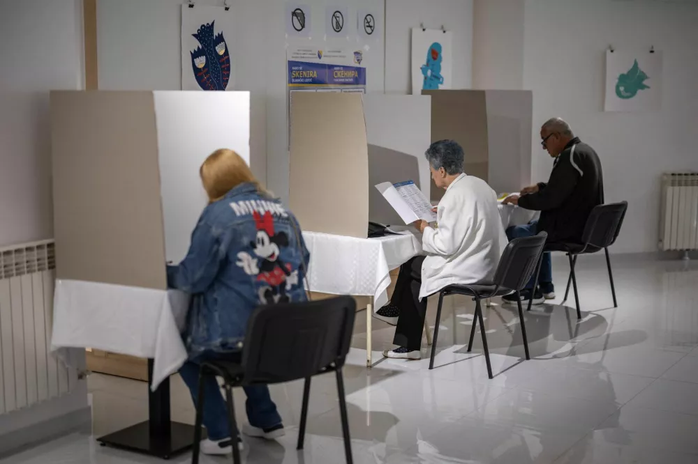 People react as they cast their ballots during Bosnia and Herzegovina's 2026 general election, in Banja Luka, Bosnia and Herzegovina, October 4, 2026. REUTERS/Marko Djurica