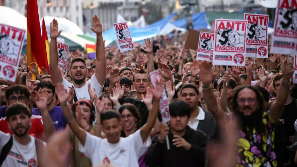 People take part in a protest against fascism and the housing crisis in Puerta del Sol square, where a camp has been set up, demanding political action to stop evictions and address the housing crisis, following the eviction of an 87-year-old woman from her home, in Madrid, Spain, October 3, 2026. REUTERS/Alejandro Martinez Velez