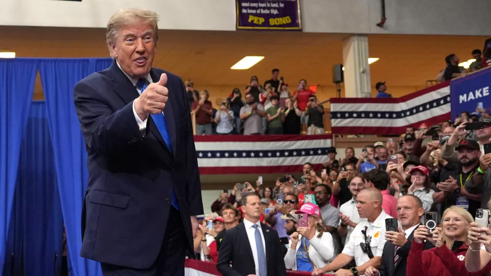 President Donald Trump arrives to speak during an event at Butler High School in Vandalia, Ohio, Saturday, Oct. 3, 2026. (AP Photo/Mark Schiefelbein)