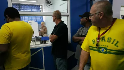 People wait in line to cast their votes at a polling station during the general election, in Sao Bernardo do Campo, Brazil October 4, 2026. REUTERS/Alexandre Meneghini