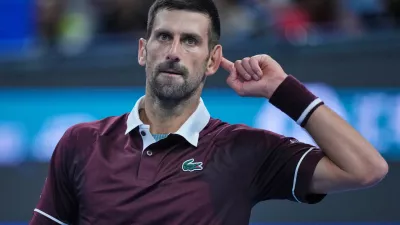 Novak Djokovic, of Serbia, reacts during play against Alex De Minaur, of Australia, during the men's singles final match at the China Open tennis tournament in Beijing, Tuesday, Oct. 6, 2026. (AP Photo/Achmad Ibrahim)