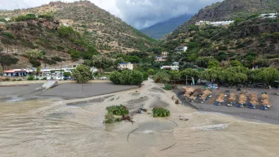 An aerial view of a flooded area near Ierapetra town, on the island of Crete, southern Greece, Saturday, Oct. 3, 2026, as severe weather causes flooding, road damage and widespread disruption across the island. (InTime News via AP)
