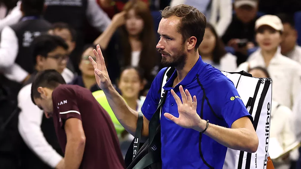 Tennis - China Open - National Tennis Center, Beijing, China - October 5, 2026 Russia's Daniil Medvedev walks off the court after being disqualified from his semi final match against Serbia's Novak Djokovic for hitting a ball into the crowd injuring a spectator REUTERS/Tingshu Wang