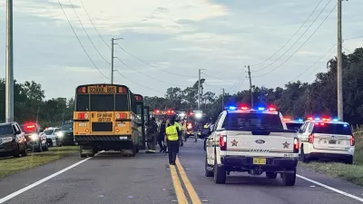 In this photo provided by the Polk County Sheriff's Office, emergency personnel respond to an accident involving a school bus in Winter Haven, Fla., on Monday, Oct. 5, 2026. (Polk County Sheriff's Office via AP)