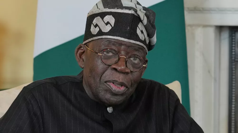 FILE -Nigerian President Bola Tinubu speaks to the media ahead of his meeting with Britain's Prime Minister Keir Starmer inside 10 Downing Street in London, Thursday, March 19, 2026. (AP Photo/Kin Cheung, Pool, File)