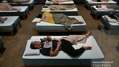 Attendees take part in a sleep competition organized by a mattress brand in Tokyo on October 5, 2026.,Fotografija: 1140761974, Licenca: Rights-managed, Omejitve:, Izdaja modela: no 