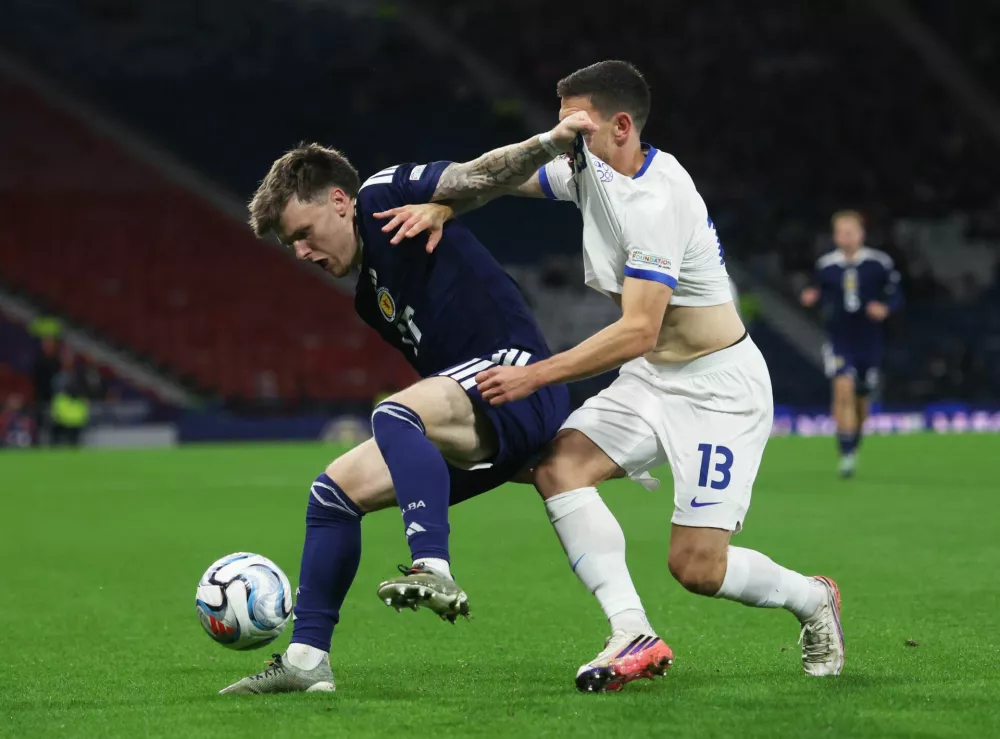 Soccer Football - Nations League - Group B1 - Scotland v Slovenia - Hampden Park, Glasgow, Scotland, Britain - October 6, 2026 Scotland's Ben Gannon-Doak in action with Slovenia's Erik Janza REUTERS/Russell Cheyne