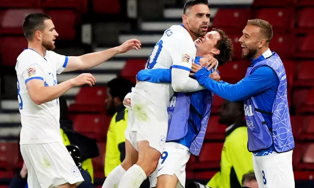 Slovenia's Aljosa Matko, center left, celebrates scoring with teammates during the Nations League soccer match between Scotland and Slovenia in Glasgow, Scotland, Tuesday Oct. 6, 2026. (Andrew Milligan/PA via AP)