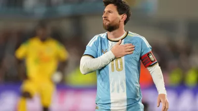 Argentina's Lionel Messi celebrates after scoring his third goal from the penalty spot during his final match for the national team, a soccer friendly against Benin, in Buenos Aires, Argentina, Tuesday, Oct.6, 2026. (AP/Photo/Gustavo Garello)