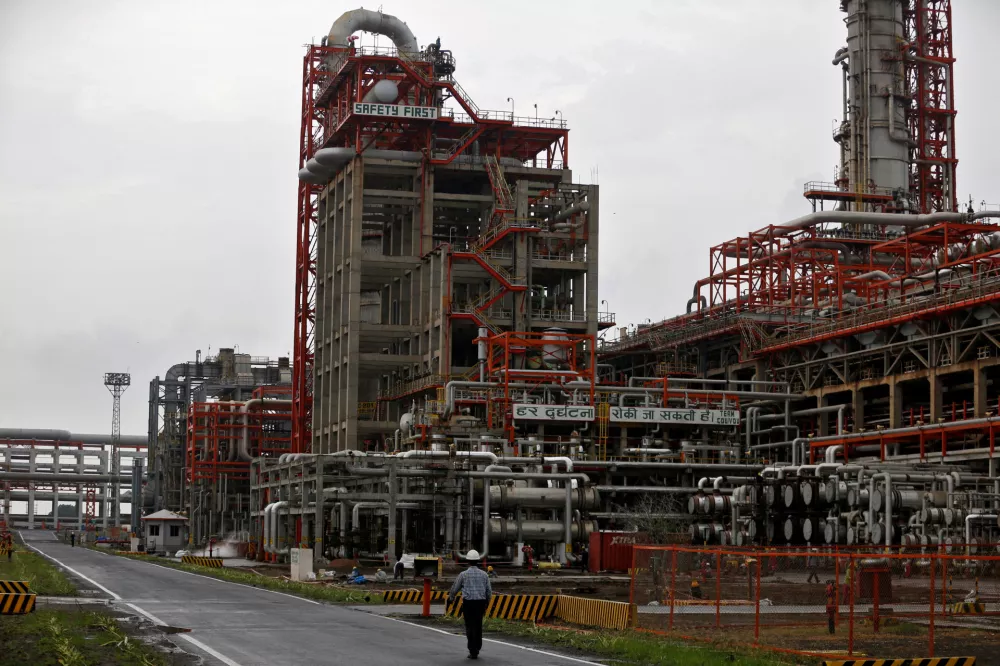 FILE PHOTO: File Photo: An employee walks inside the premises of an oil refinery of Essar Oil, which runs India's second biggest private sector refinery, in Vadinar in the western state of Gujarat, India, October 4, 2016. Picture taken October 4, 2016. REUTERS/Amit Dave/File Photo/File Photo