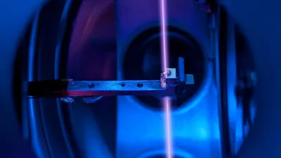 A calcium fluoride crystal, in its holder, that incorporates large numbers of thorium nuclei is seen inside the vacuum system of a nuclear clock, with a laser beam probing the thorium nuclei, at a laboratory at TU Wien in Vienna, Austria, in this handout image released on October 7, 2026. T. Schumm, TU Wien/Handout via REUTERS  THIS IMAGE HAS BEEN SUPPLIED BY A THIRD PARTY. NO RESALES. NO ARCHIVES. QUALITY FROM SOURCE.