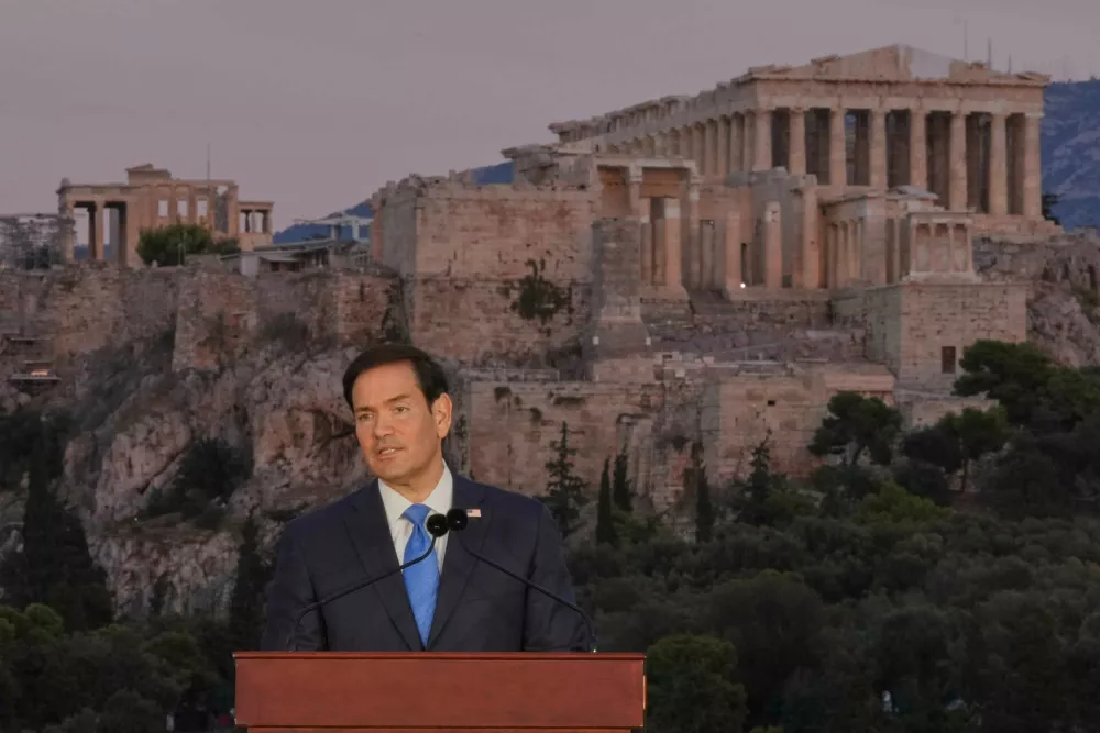 U.S. Secretary of State Marco Rubio speaks at the Pnyx hill, where ancient Athenians held democratic assemblies, with the ancient Parthenon temple atop the Acropolis in the background, in Athens,Wednesday, Oct. 7, 2026. (AP Photo/Mark Schiefelbein, Pool)
