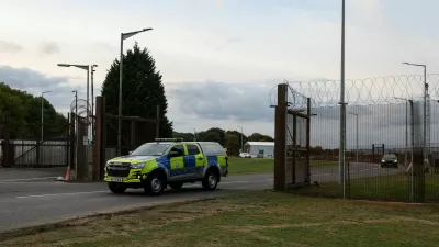 A police car leaves RAF Molesworth, after two Latvian nationals were arrested on suspicion of entering a prohibited place for a purpose prejudicial to the UK, police said in a statement, in Cambridgeshire, Britain, October 8, 2026. REUTERS/Chris Radburn   TPX IMAGES OF THE DAY