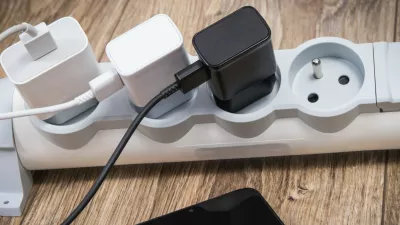 Smartphone, mobile phone and chargers connected to electrical power strip. Various devices charging concept. Smartphone and chargers connected to electrical power strip. Various devices charging concept,Image: 1129613115, License: Royalty-free, Restrictions:, Model Release: no 