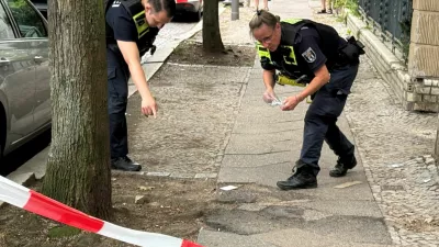 Police officers secure evidence at the scene of a shooting at Berlin's Steglitz district, Germany, June 27, 2026. Picture taken with a phone. REUTERS/Fabrizio Bensch