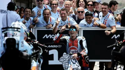 MotoGP - Indonesian Grand Prix - Mandalika International Street Circuit, Mandalika, Indonesia - October 10, 2026 Trackhouse MotoGP Team's Raul Fernandez celebrates with team members after qualifying in pole position REUTERS/Willy Kurniawan